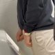Hung uncut guy caught taking a leak at the urinals