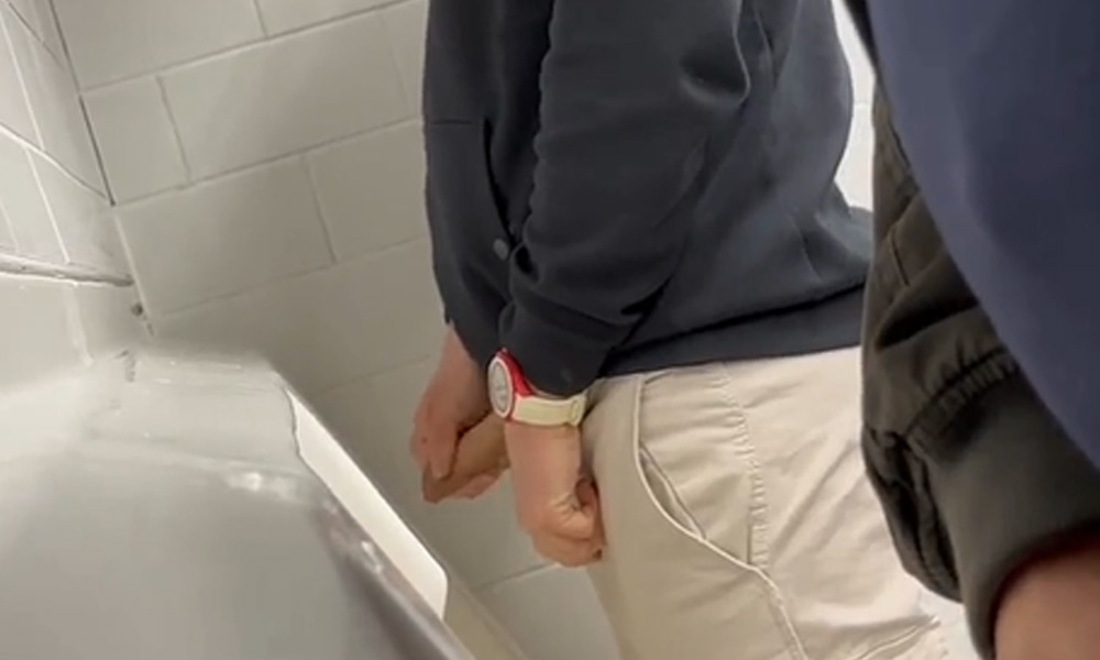 Hung uncut guy caught taking a leak at the urinals