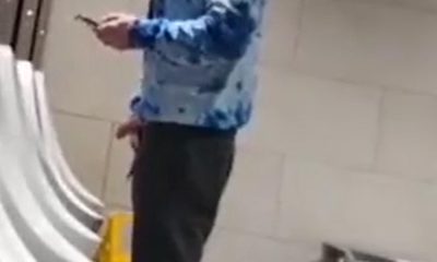 Hung lad caught taking a leak at urinals