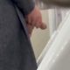 Man with enormous dick caught peeing with balls out at urinals