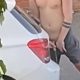 Shirtless guy caught peeing in the street