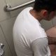 Tattooed guy caught masturbating in public toilet