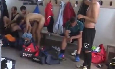 Footballers undressing and celebrating naked in locker room
