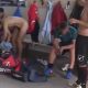 Footballers undressing and celebrating naked in locker room